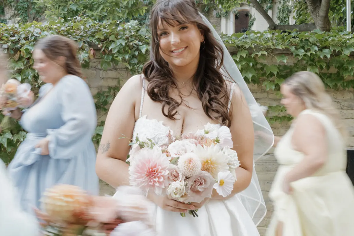 Close up of bride Katie engagement ring with her bridal bouquet